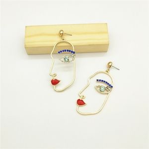 H&M | rhinestone face earrings